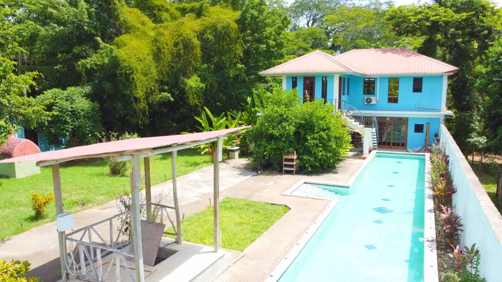 Featured image Riverfront Income Potential with Five (5) Buildings + Lap Pool near San Ignacio Town, Cayo, Belize